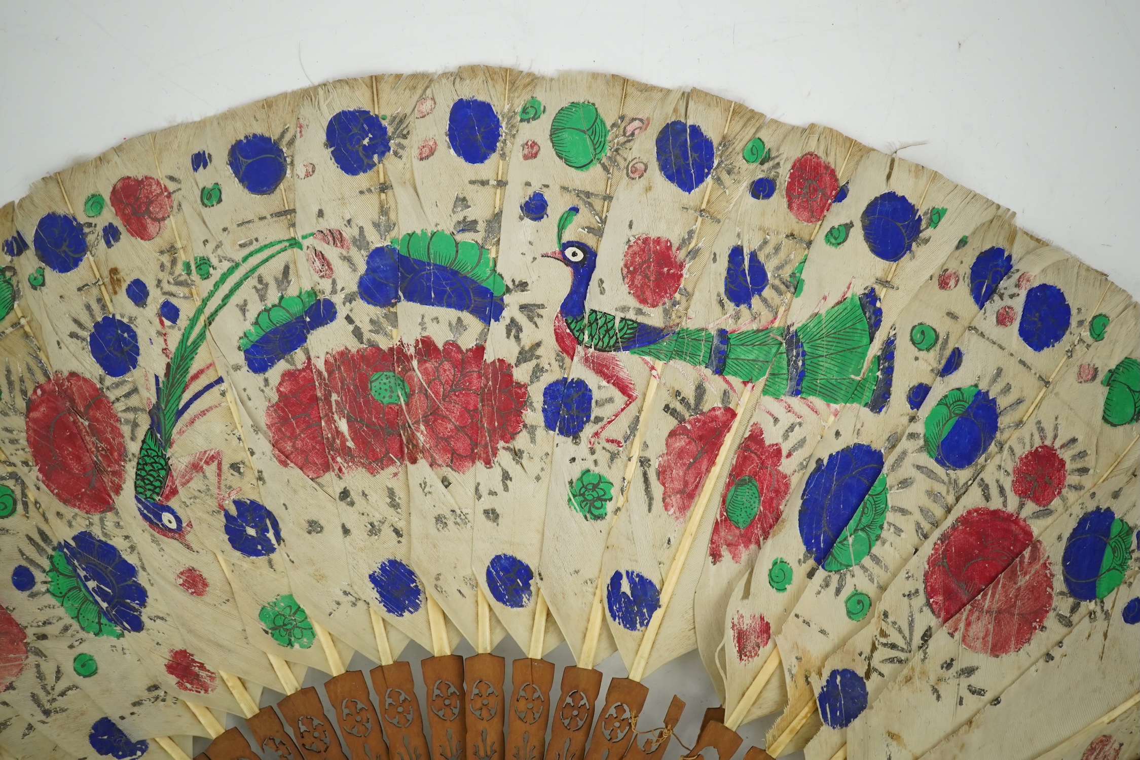 Three 19th century Chinese feather fans: One a carved bone brise black feather fan together with two similar carved sandalwood feather fans, two fans have hand painted decoration on the feathers both sides, the pink feat